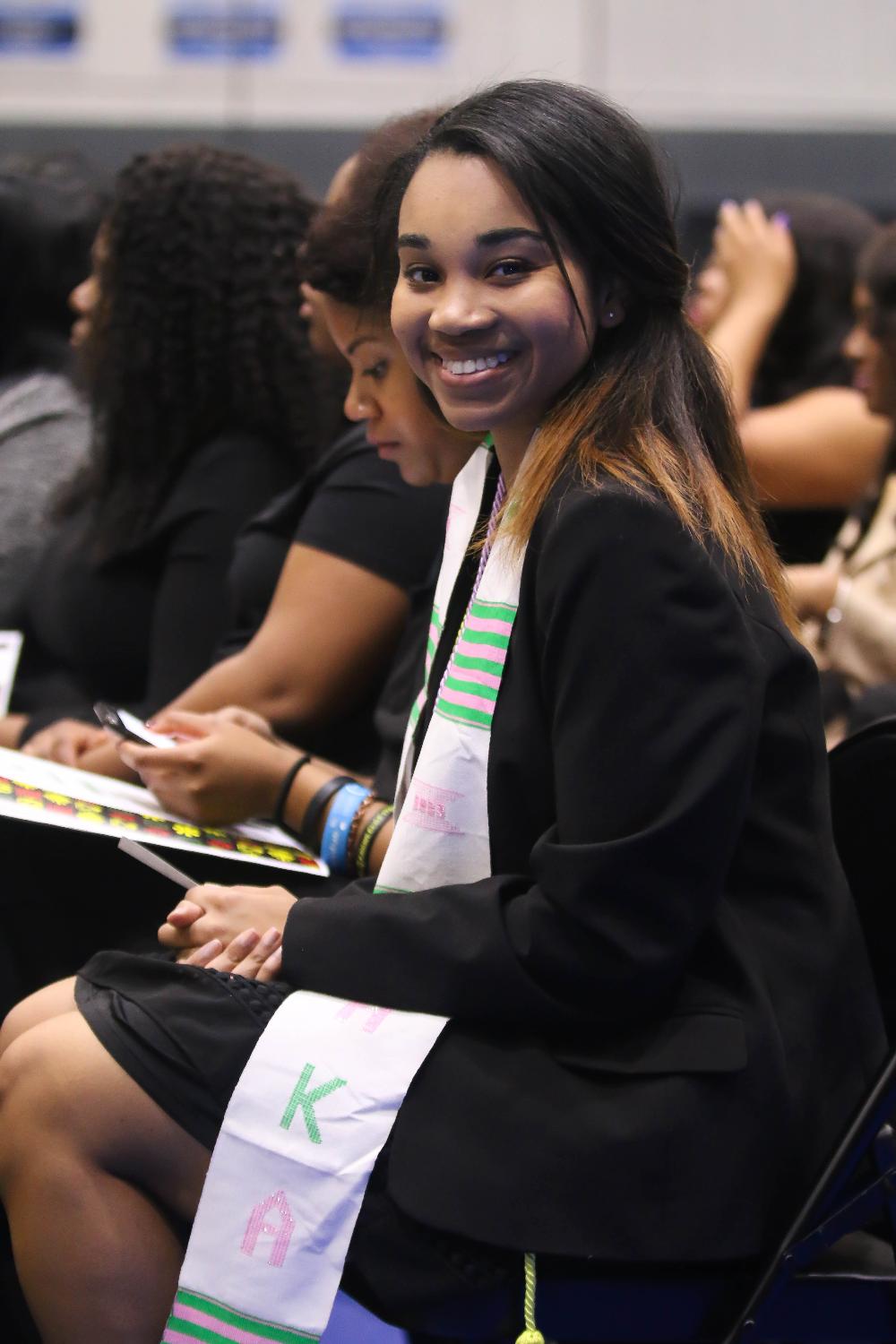 Black graduate smiling